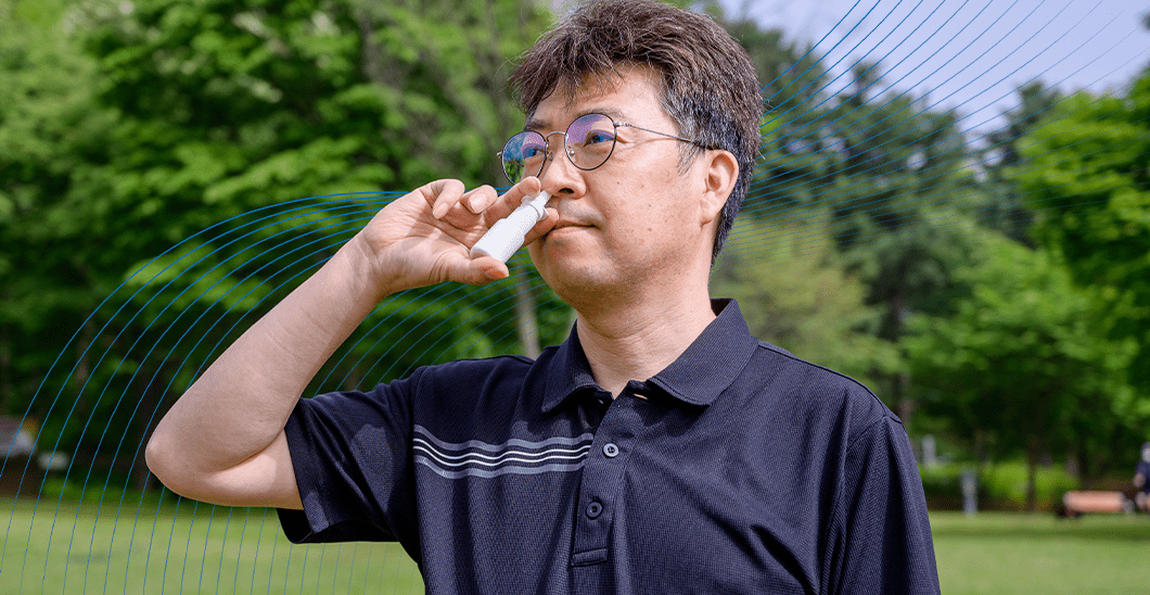 Man uses nasal spray for Men's Health