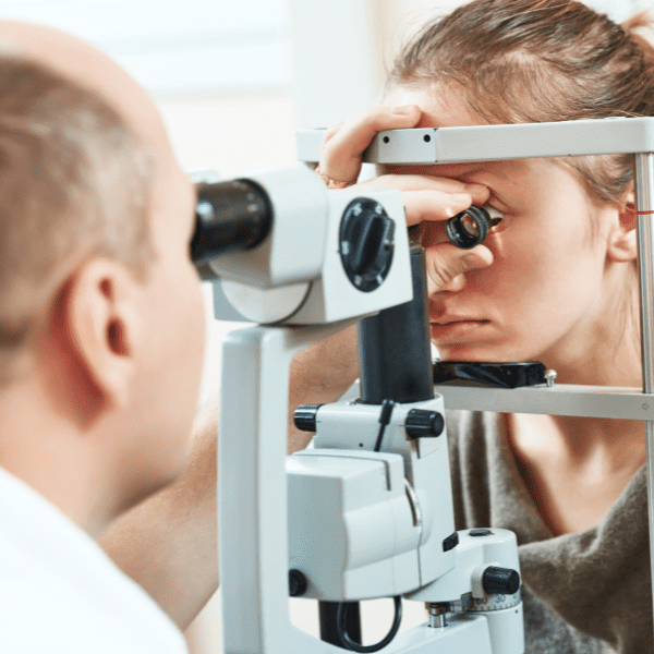 Woman getting eye examined by ophthalmologist 