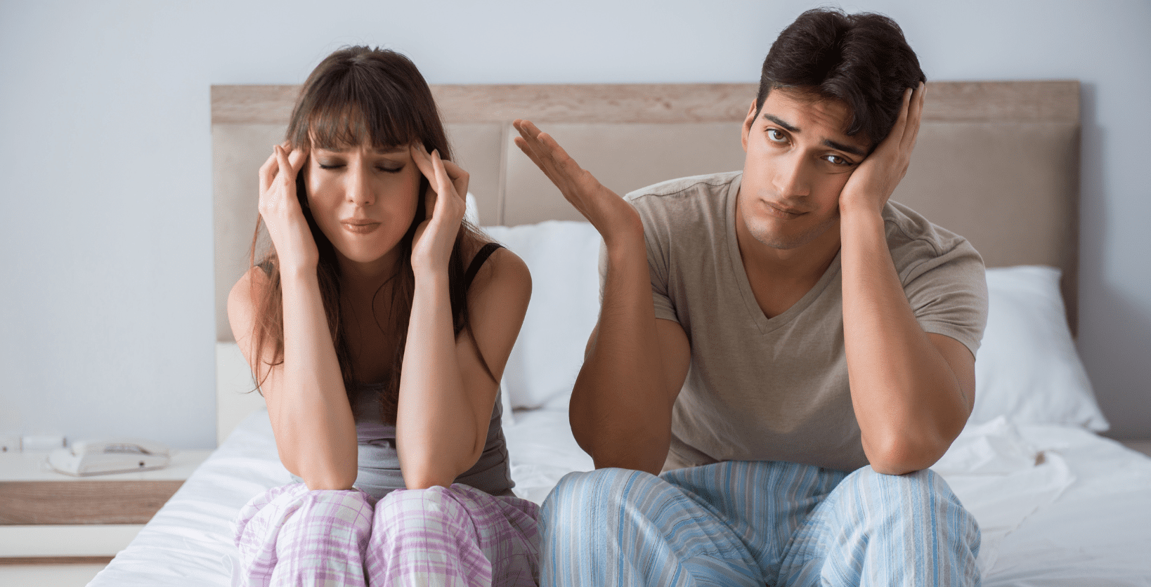  A young woman and a young man stretch their legs before exercising.